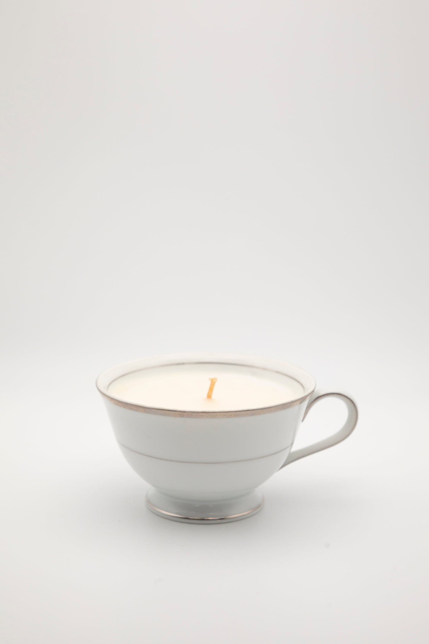 white with silver design teacup