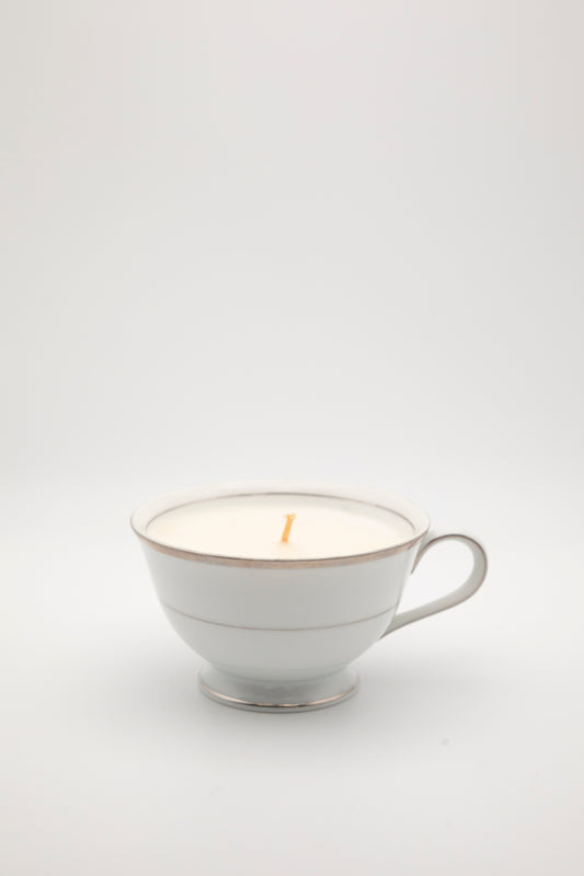 white with silver design teacup