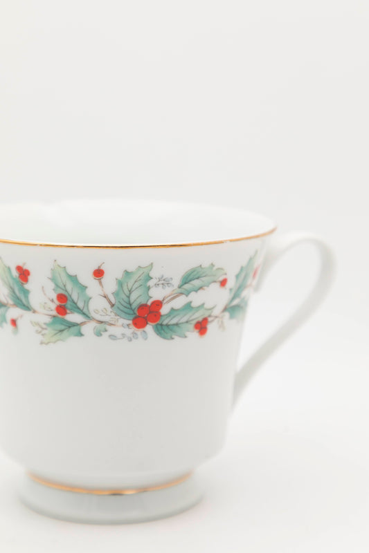 white mug with mistletoe design