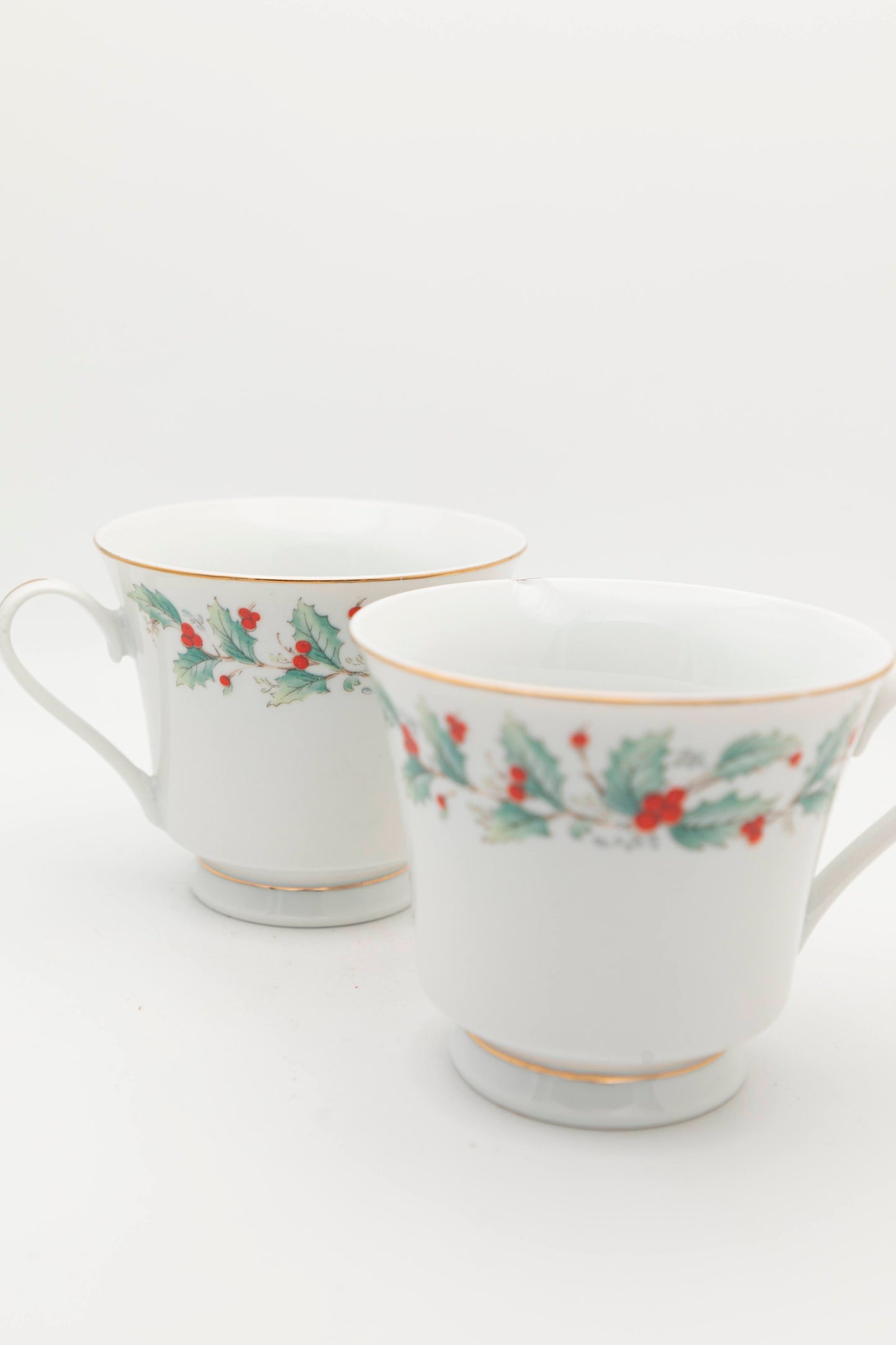 white mug with mistletoe design