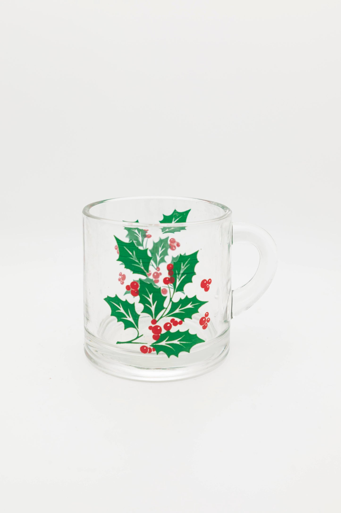 small glass mug with mistletoe