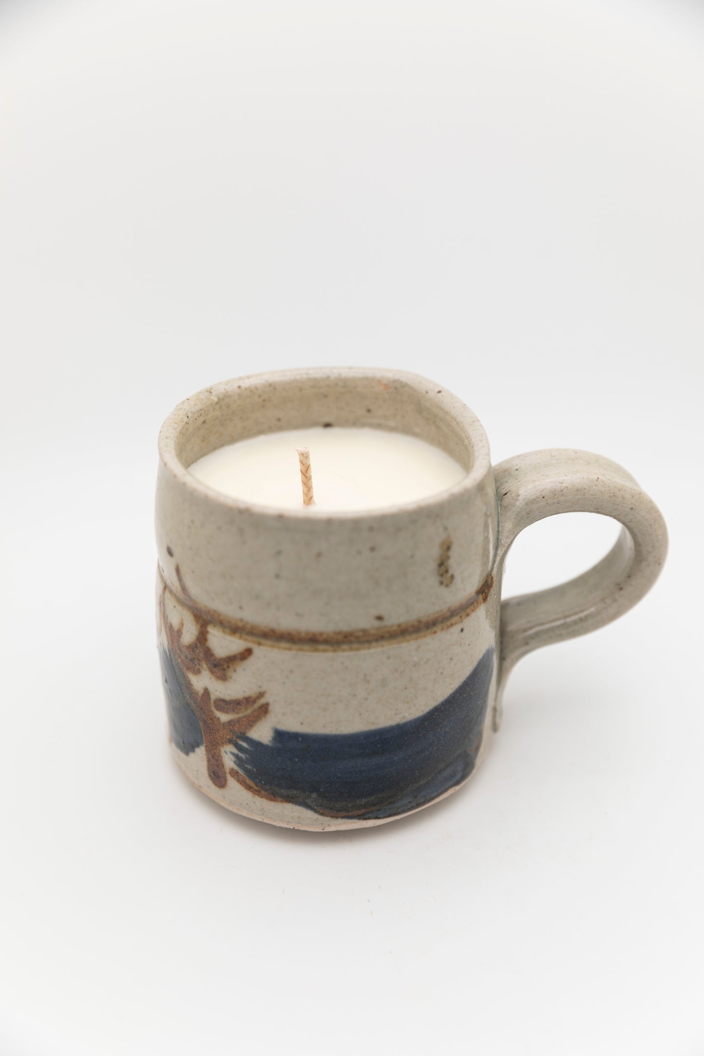 ceramic mug with blue and brown design