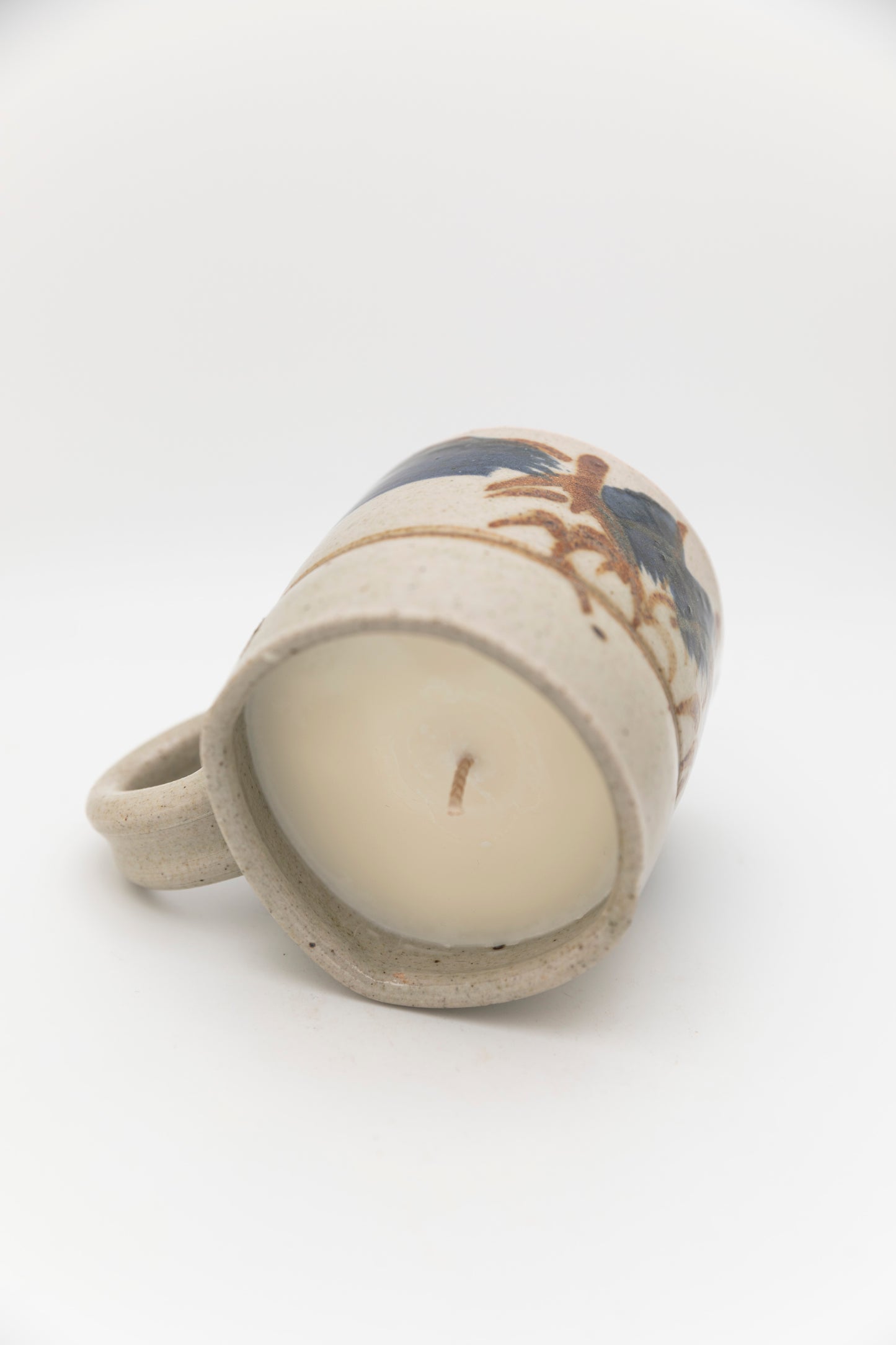 ceramic mug with blue and brown design