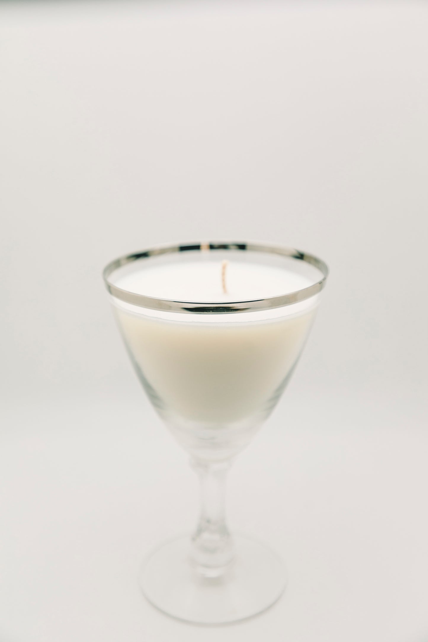 silver rimmed drinking glass