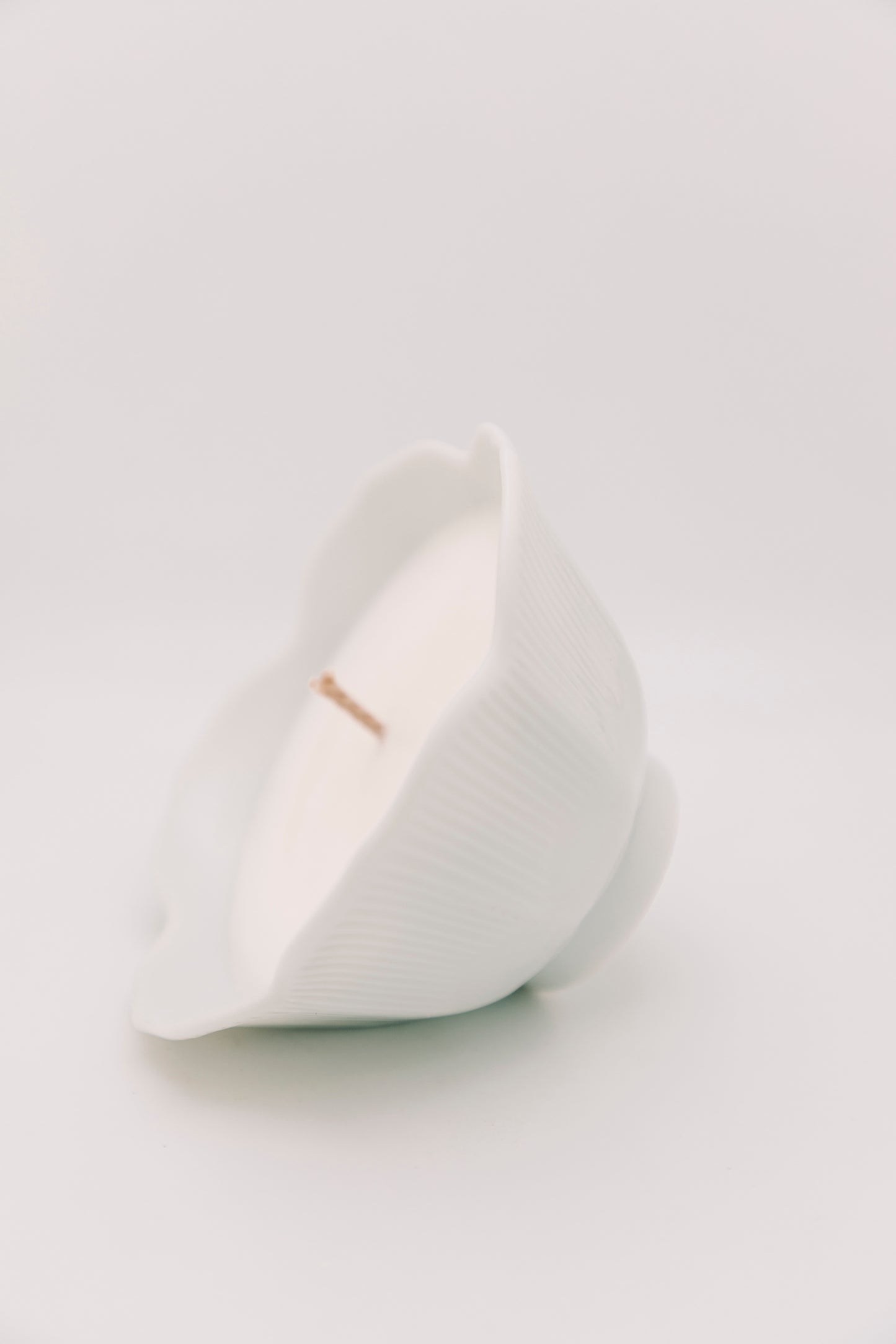 floral shaped white ceramic vessel